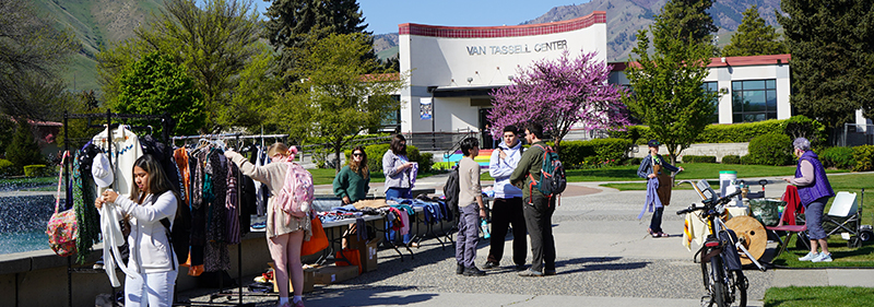 Earth Day Wednesday 2025 Event Earth Day event with students near the WVC fountain looking at used clothing availabe.